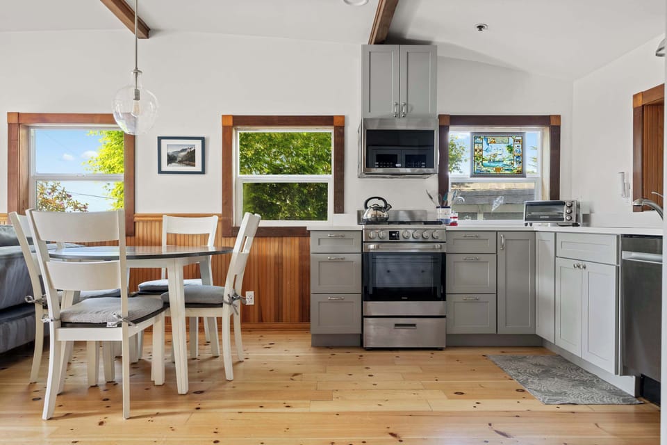 The kitchen flows seamlessly into the dining space, creating an open and inviting layout for shared meals.