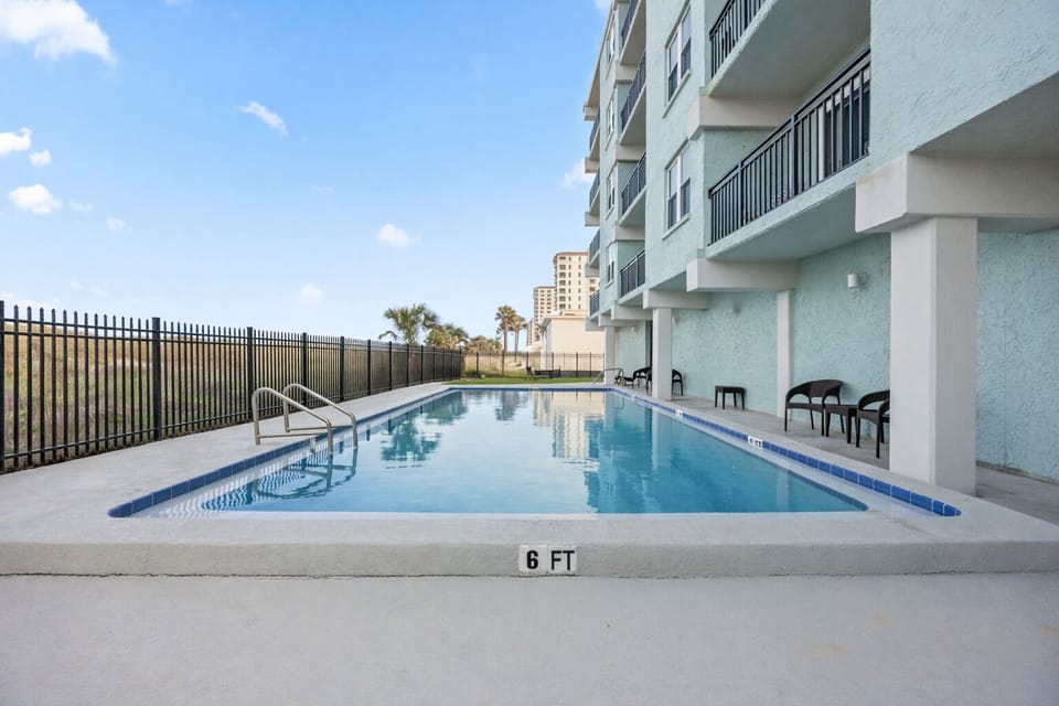 Relax at the community pool just steps away