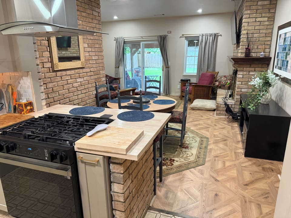 Open Living room, Dining and Kitchen, brick woodburting fireplace 