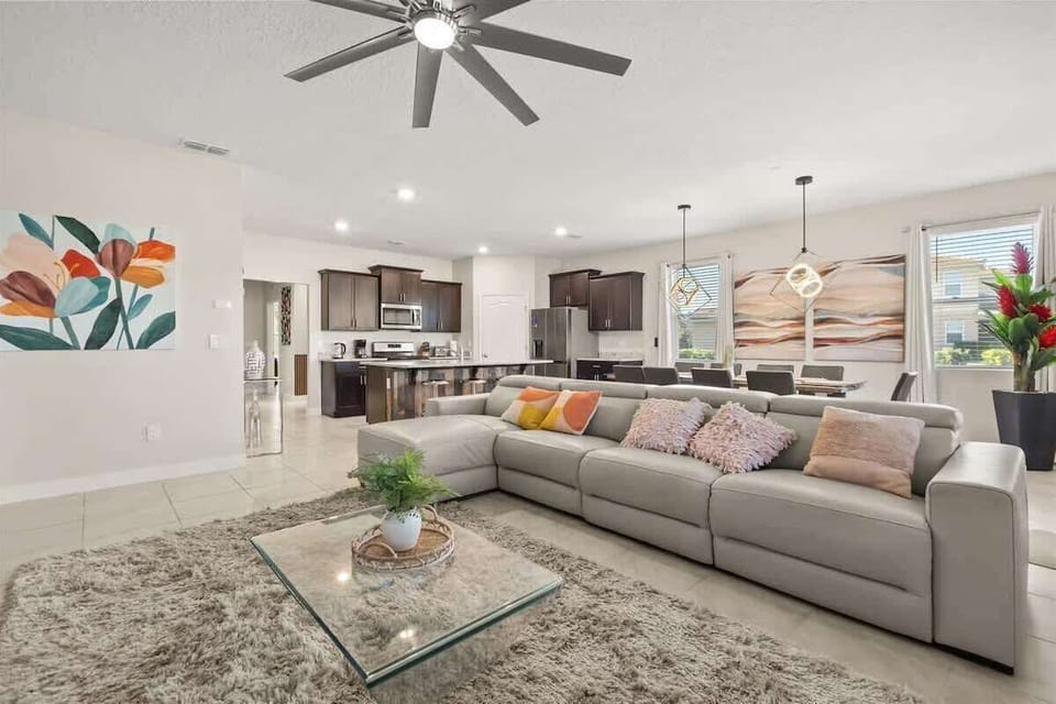 Unwind in this beautifully designed living room, where comfort meets modern elegance. With warm tones, stylish finishes, and a cozy atmosphere, this space is perfect for relaxing after a fun day exploring Orlando.
