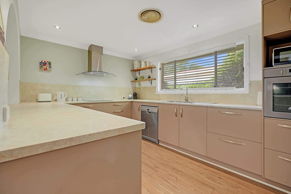 Kitchen + Coffee Machine + Breakfast Bar with Stools