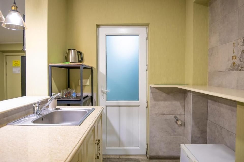 Family Studio, Courtyard View | Private kitchen | Fridge, microwave