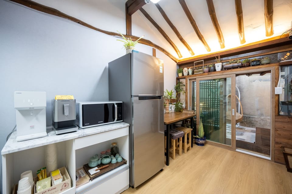 Full-size fridge, microwave, stovetop, cookware/dishes/utensils