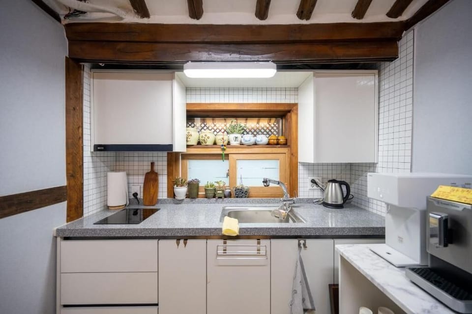 Full-size fridge, microwave, stovetop, cookware/dishes/utensils
