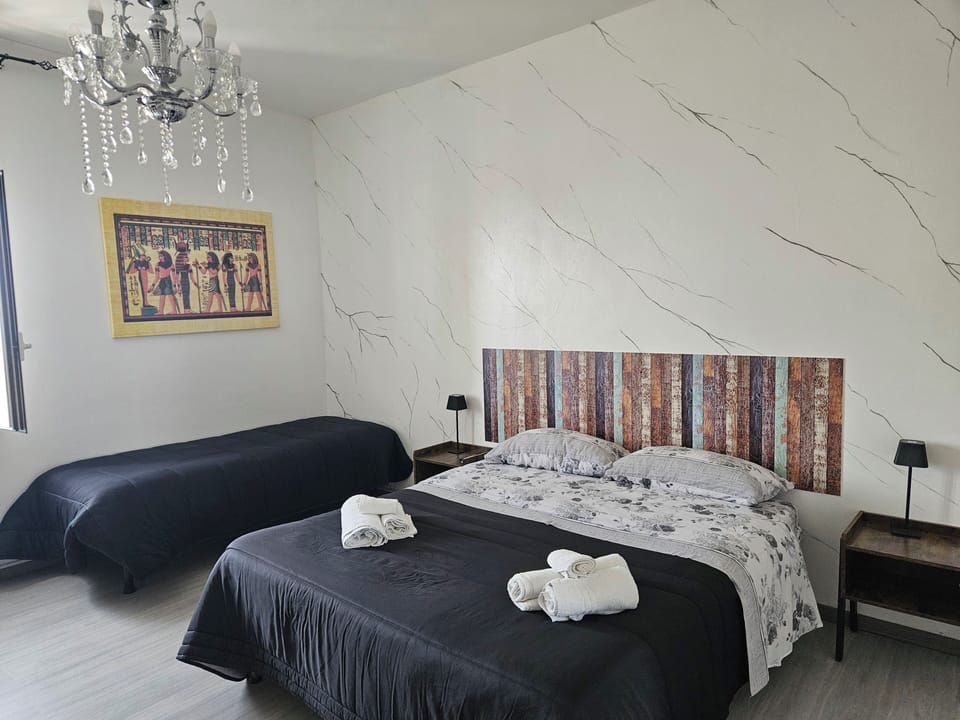 Deluxe Triple Room, Sea View | Desk, laptop workspace, bed sheets