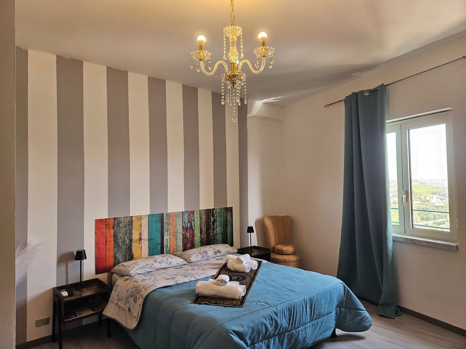 Deluxe Room, City View | Desk, laptop workspace, bed sheets