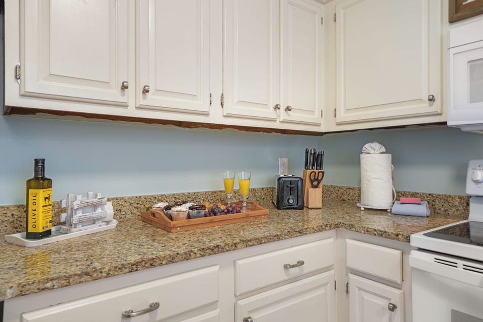 Fully equipped galley kitchen at this dune-front retreat. Granite counters, full-size appliances, and everything to cook for 6.