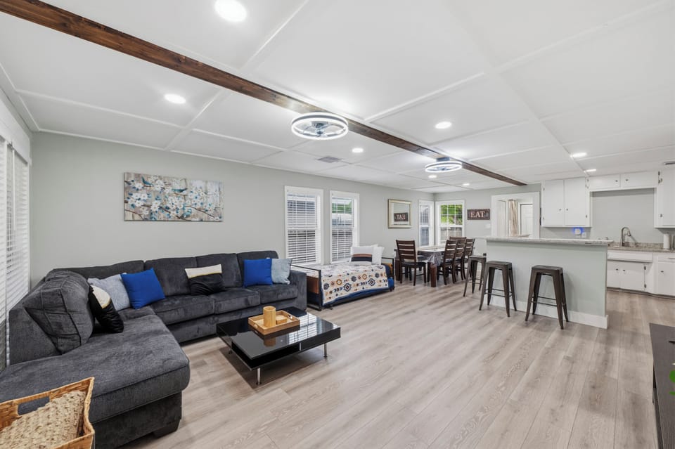 Our open-concept living area seamlessly connects the kitchen, dining, and lounge spaces for effortless group gatherings.