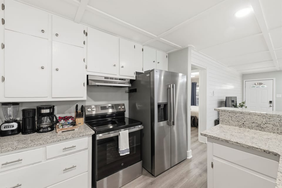 Stylish quartz countertops and modern lighting add a touch of luxury to your daily vacation routine.