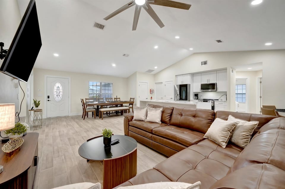 Living room with sectional sofa and wall-mounted TV