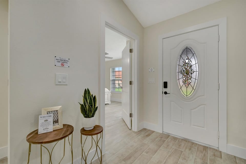 Entryway with front door and side table decor