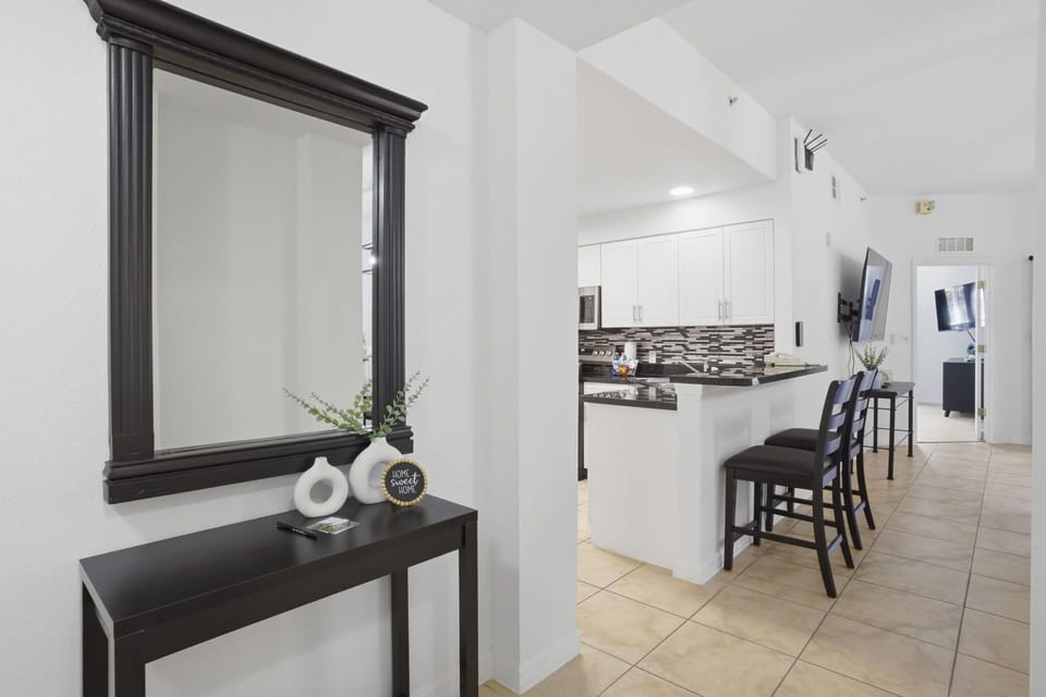 Welcoming entry with a convenient breakfast bar—perfect for quick meals or morning coffee.