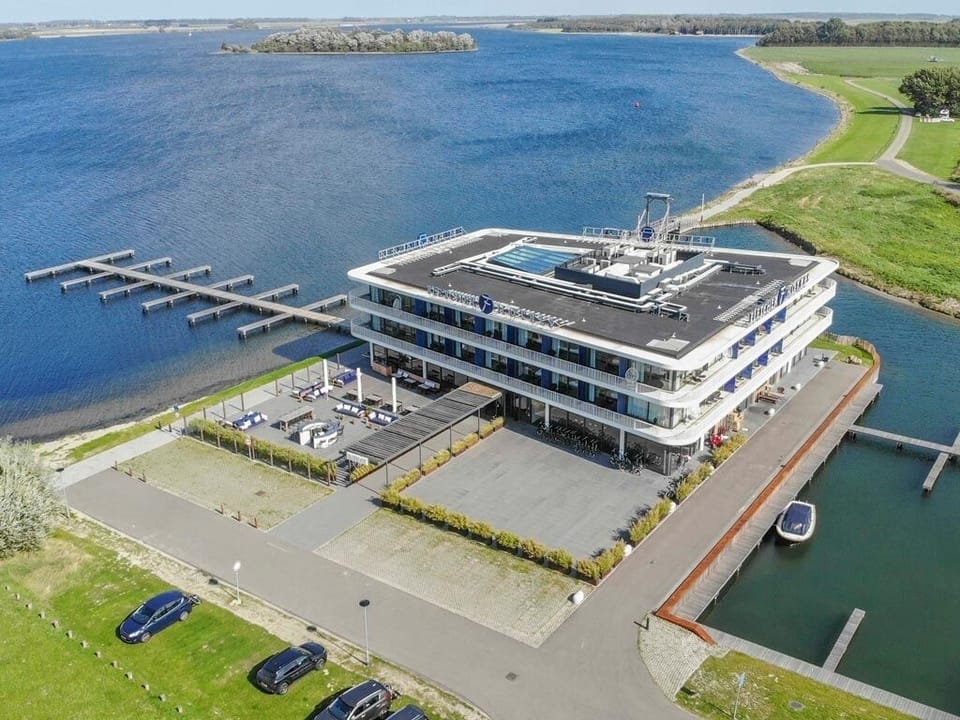 Arrive to a sleek waterfront escape with marina views.