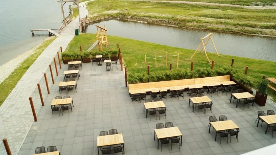 Gather outside for sunset drinks with open-air waterfront views.