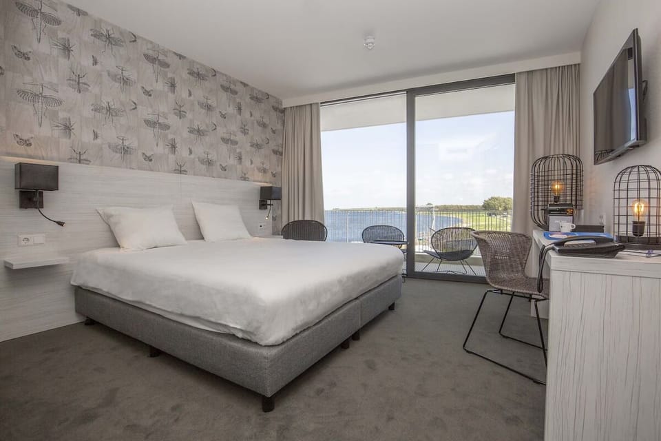Lounge by the window as tranquil water views steal attention.