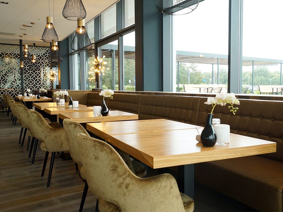 Settle into a stylish booth for relaxed, linger-longer dinners.