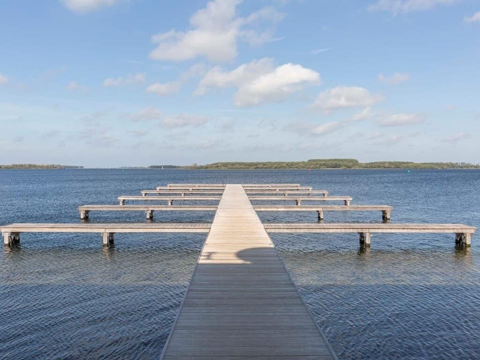 Stroll the long pier and breathe in lake serenity.