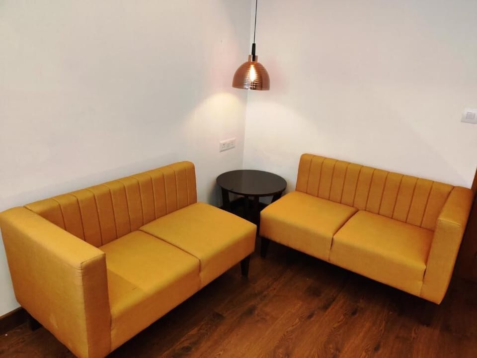 Family Twin Room, City View | Living area | TV