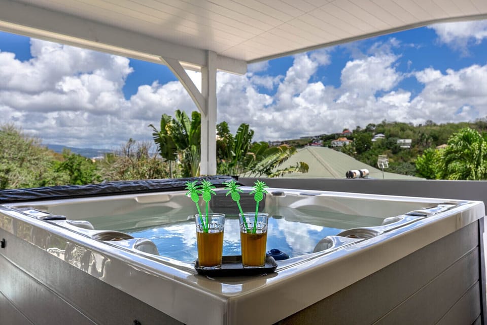 Treat yourself to a wellness retreat at Villa Émeraude. Relax in your private spa on the covered terrace while enjoying unobstructed views of the lush green landscapes of Trois-Îlets.