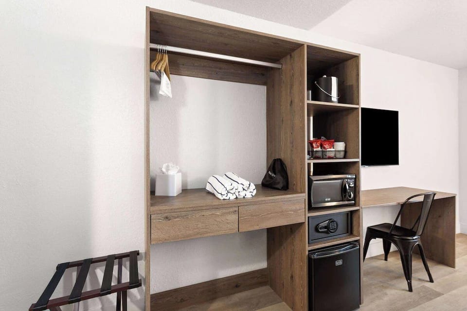 Get productive at the dedicated desk with TV entertainment nearby.