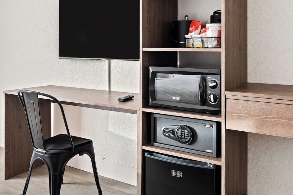 Snack anytime with microwave, mini-fridge, and in-room safe.