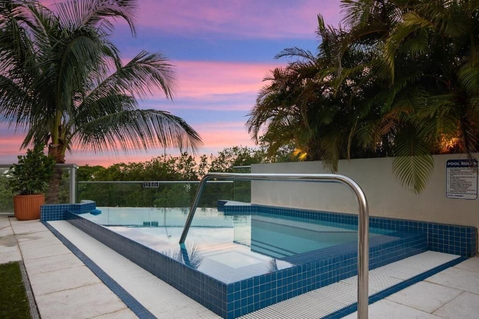 Soak at sunset as the sky melts into tropical serenity.