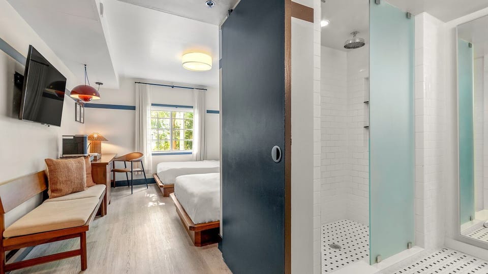 Step into a sleek, modern bath for a fresh start.