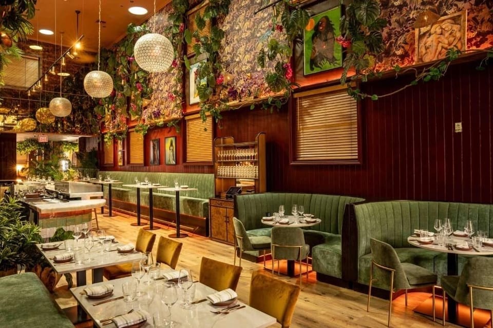 Gather for an elegant dinner beneath glowing pendant lights.