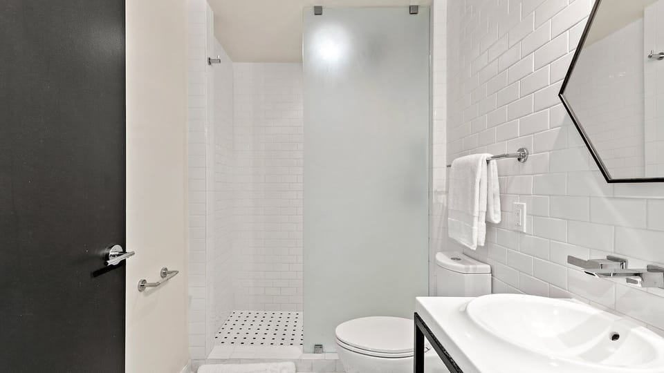 Refresh in a sleek shower bath with crisp, spa-like finishes.