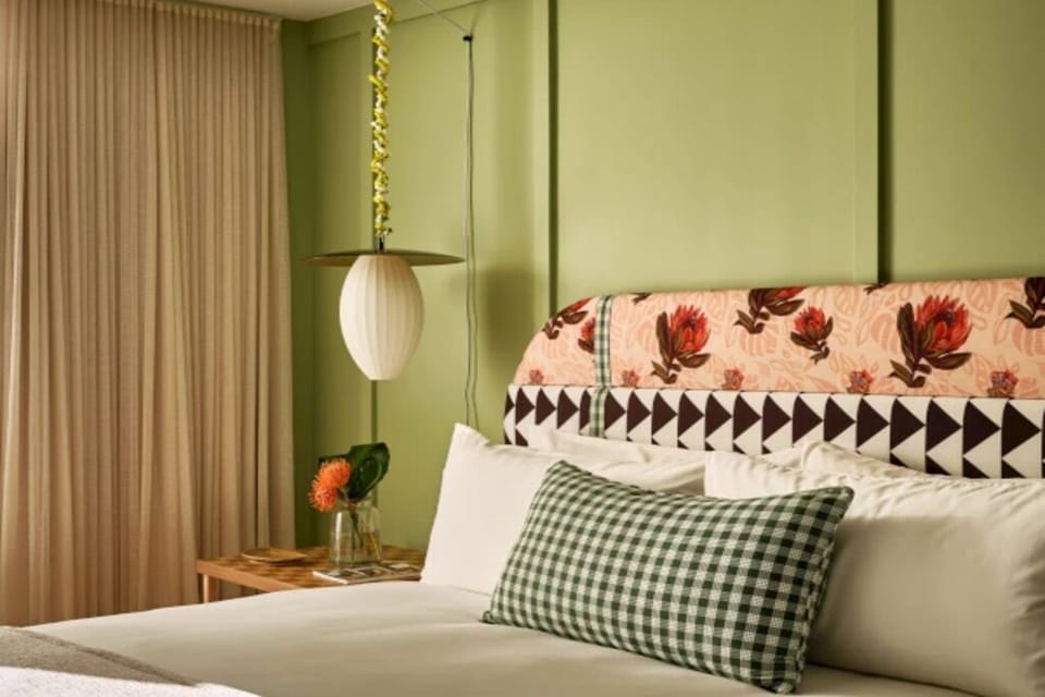 Sink into plush pillows as soft drapes hush the room.