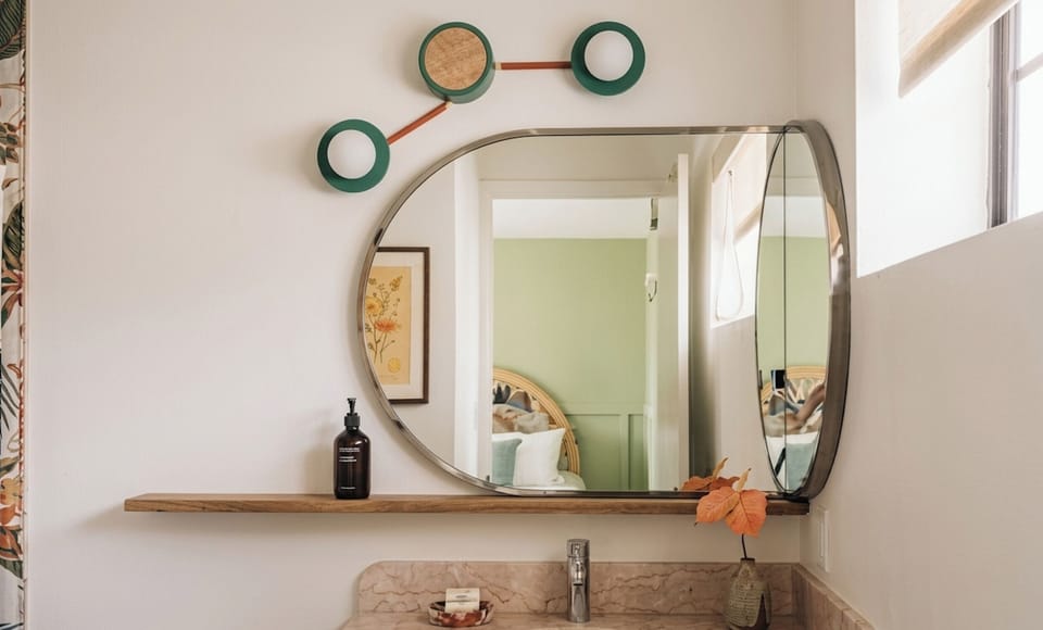Refresh at the bright vanity with mirror and warm lighting.