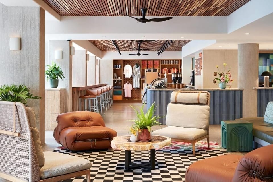 Gather for conversation beneath warm wood ceilings and soft lighting.