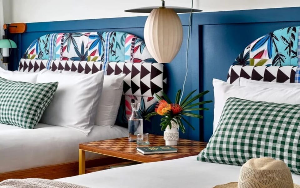 Settle in with plush pillows and warm bedside lighting.