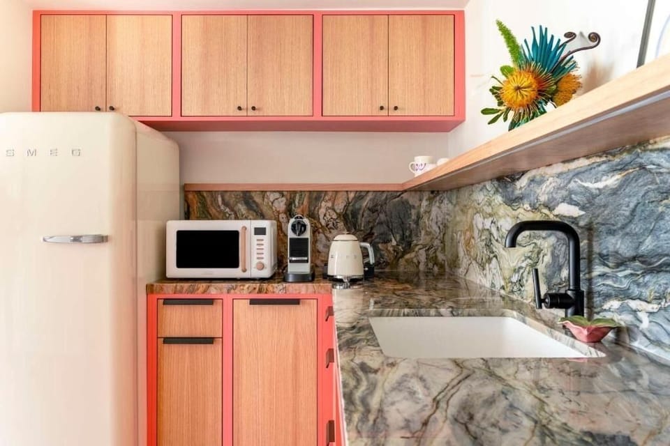 Cook effortlessly on glossy stone counters with modern appliances.