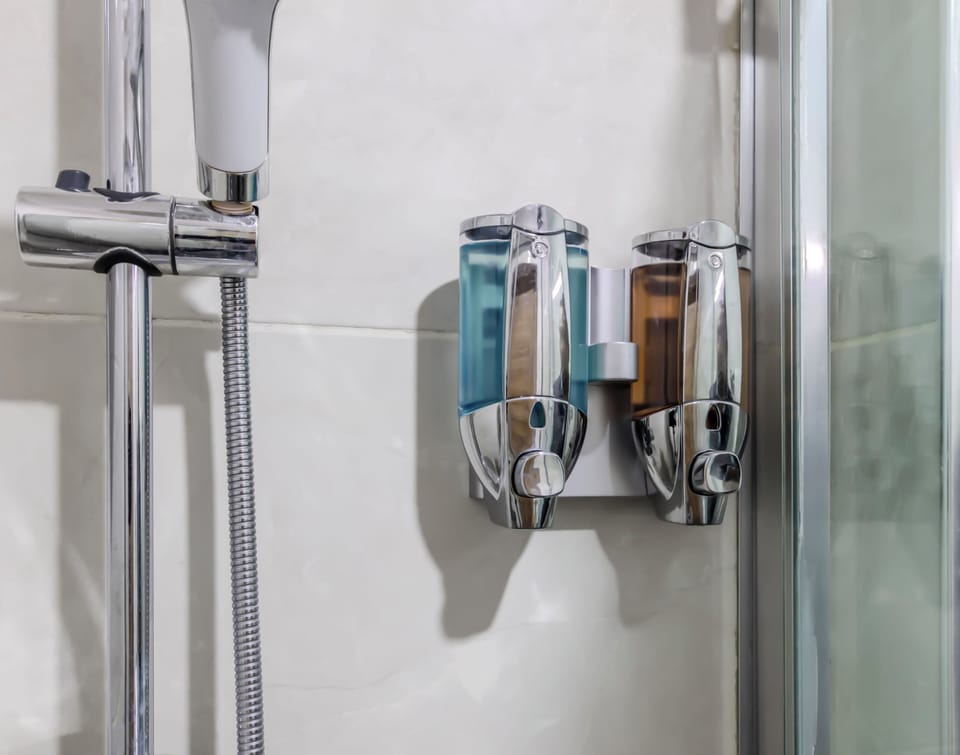 Shower, hair dryer, slippers, towels