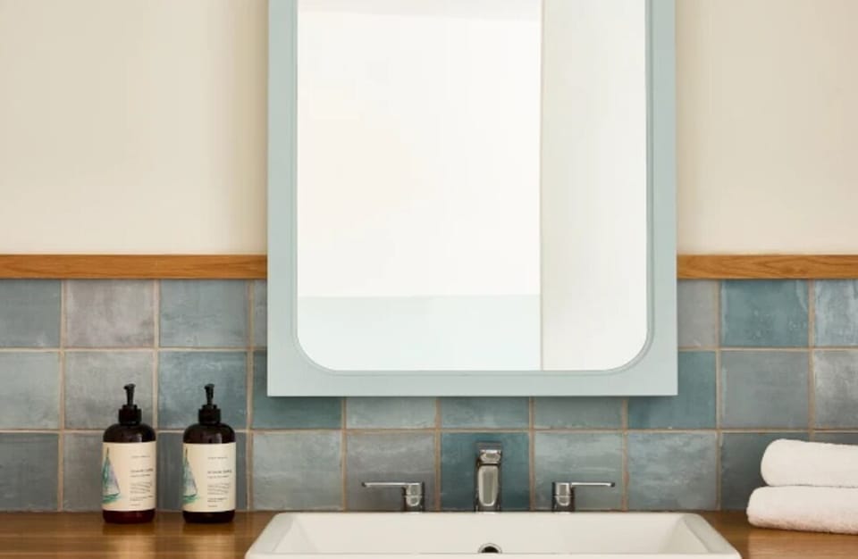 Start your day with a bright vanity and plush towels.
