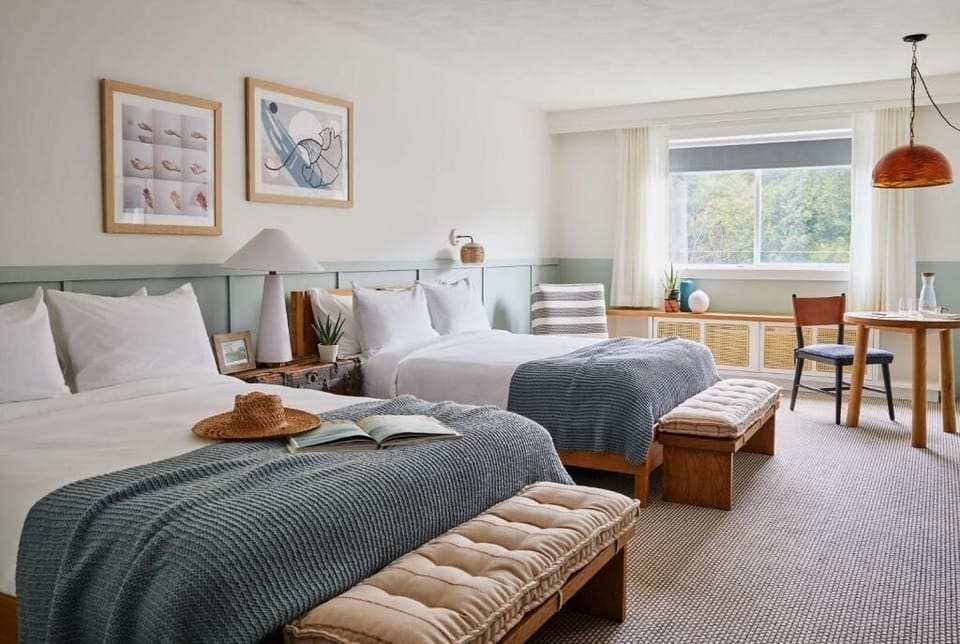 Settle into crisp beds in a serene, sunlit retreat.
