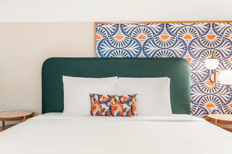 Drift off fast with plush pillows and vibrant designer accents.