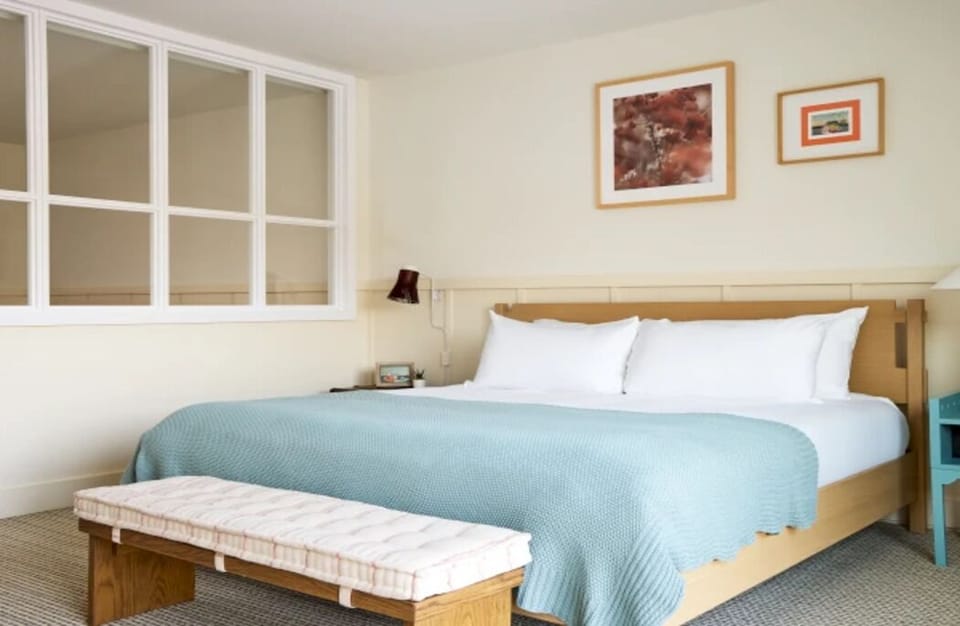 Drift off in a cozy bed with soothing, minimalist decor.