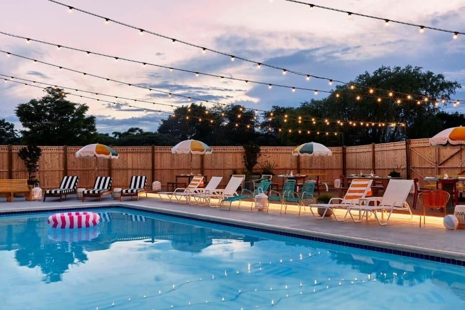 Unwind under twinkling lights with a refreshing evening swim.