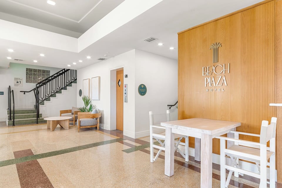 Unwind in the airy lobby lounge before beach adventures.