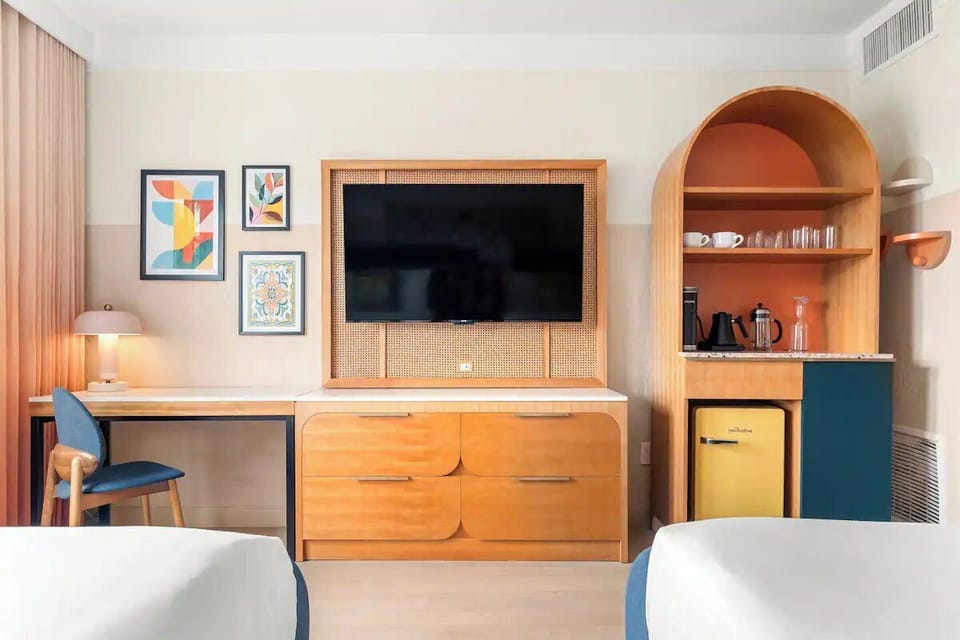 Kick back with big-screen entertainment and convenient in-room drinks.