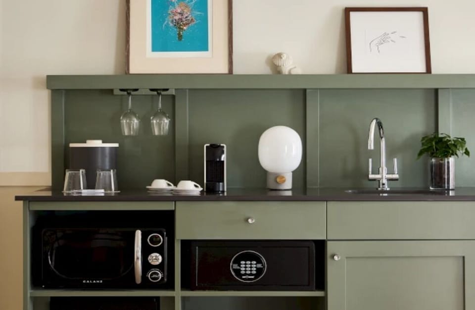 Refresh with morning coffee and easy snacks at the chic kitchenette.