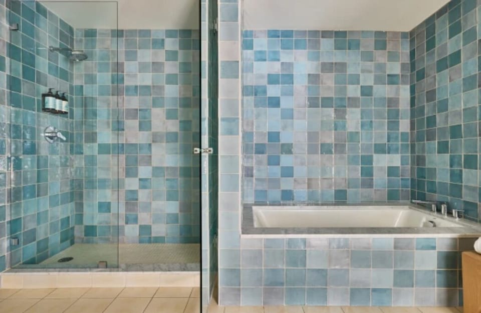 Rinse off in the glass shower or soak in the deep tub.