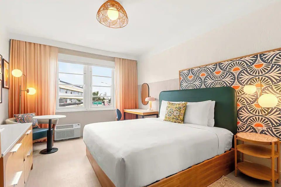 Unwind in a sunlit bedroom with bold, modern design.