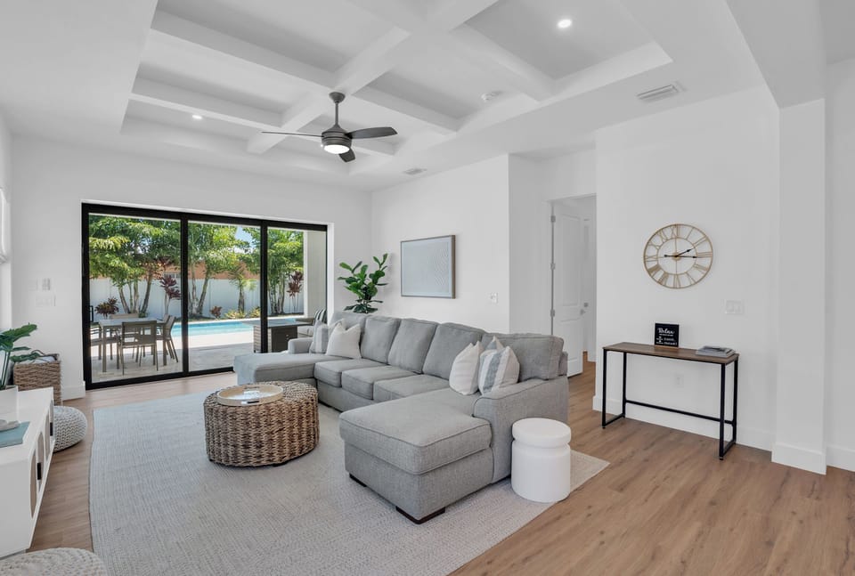 Bright, open living space with easy access to the pool & patio