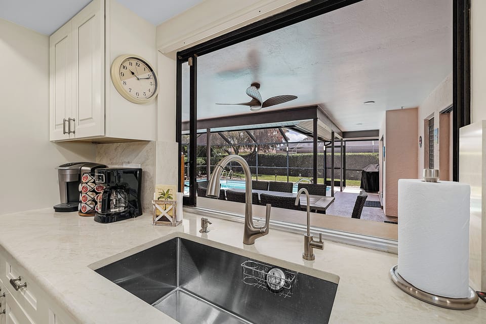 View of pool area from kitchen pass through window.
