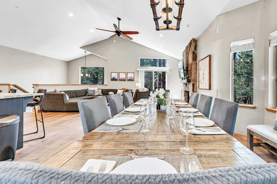 Main dining room:  wooden table, contemporary decor, and unobstructed views of the outdoors and the social area.