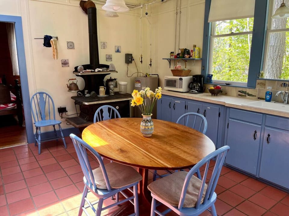 Enter the home through the cozy kitchen area