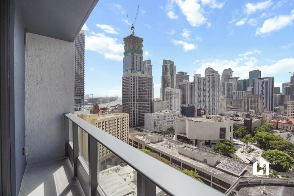 Take in panoramic views of the bustling city from your private balcony.
